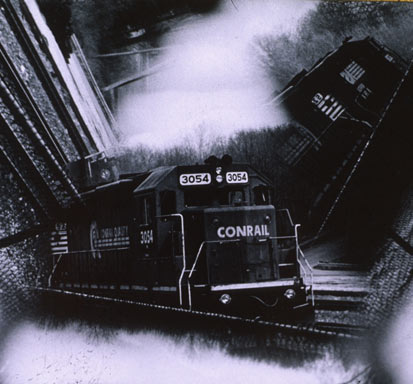 "Train". Silver gelatin print from constructed kaleidoscopic lens.